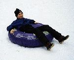 Nevin going down the slopes on a tire