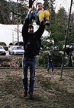 Tom doing an underdog at the playground